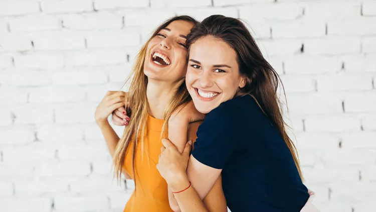 Friends dancing indoors