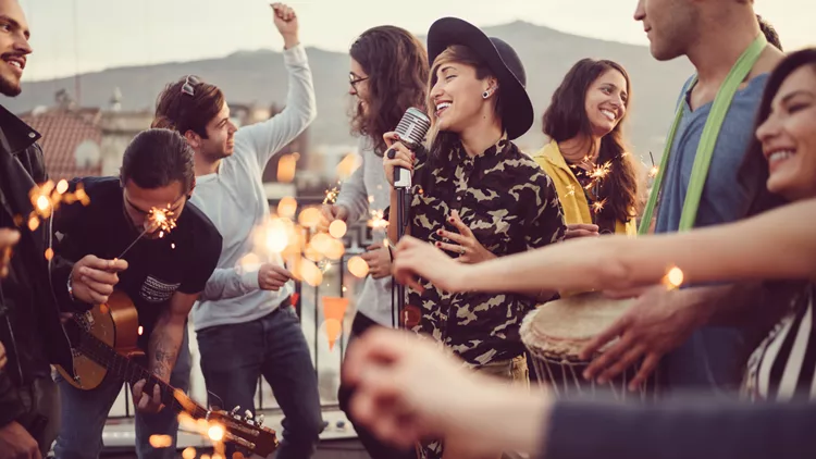 Friends celebrating New Year on rooftop party