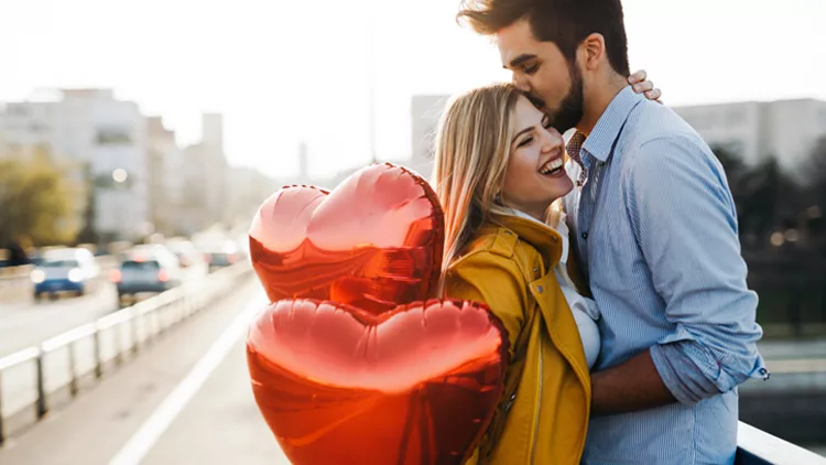 Romantic young couple in love, hugging on the street