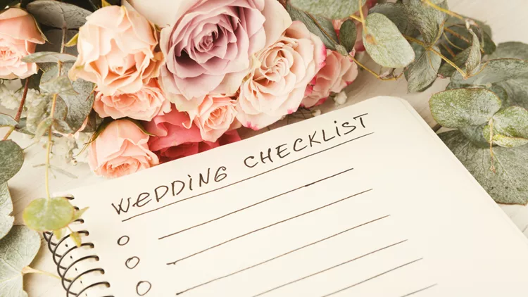 Wedding checklist and rose bouquet