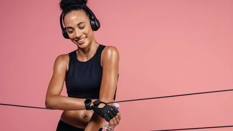 Smiling woman resting after workout