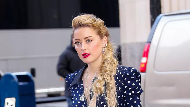 Amber Heard wears a polka dotted blue dress in New York