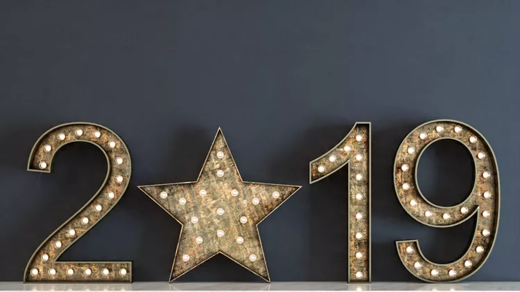 Happy New Year 2019. Shiny Typography with light bulbs