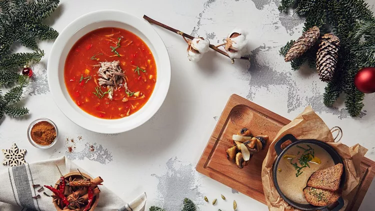 Beautiful New Year Background with Mushroom and Tomato Soups Top View
