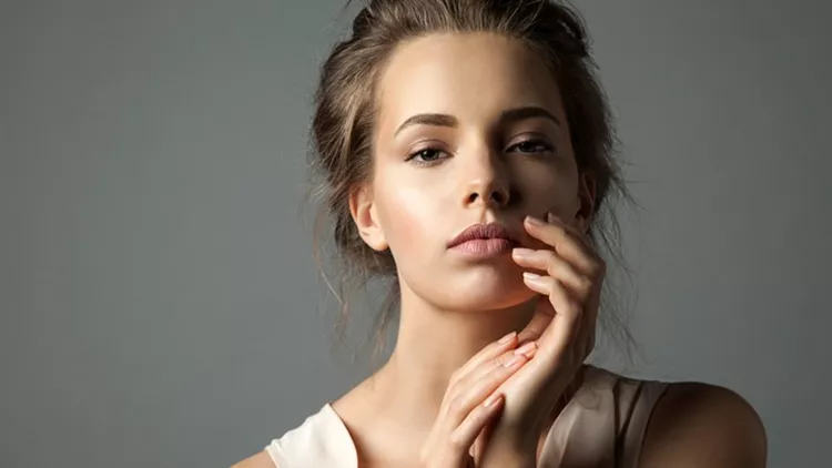 Pretty young woman watching at camera