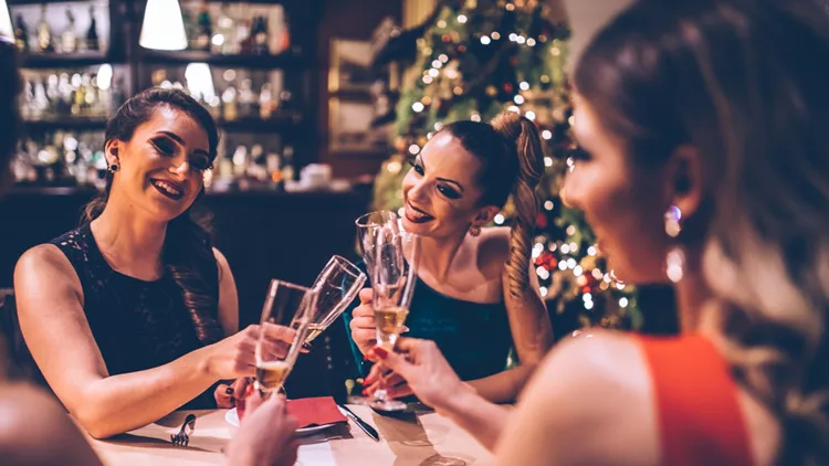 Pretty women at dinner party