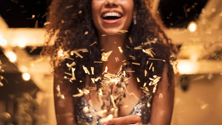 Woman holding fire sparkler