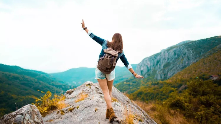 hippie-woman-stroll-on-mountain-picture-id612619528