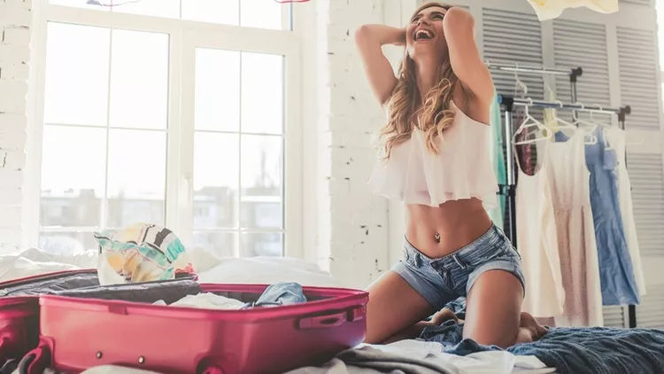 young-woman-preparing-for-traveling-picture-id918673260