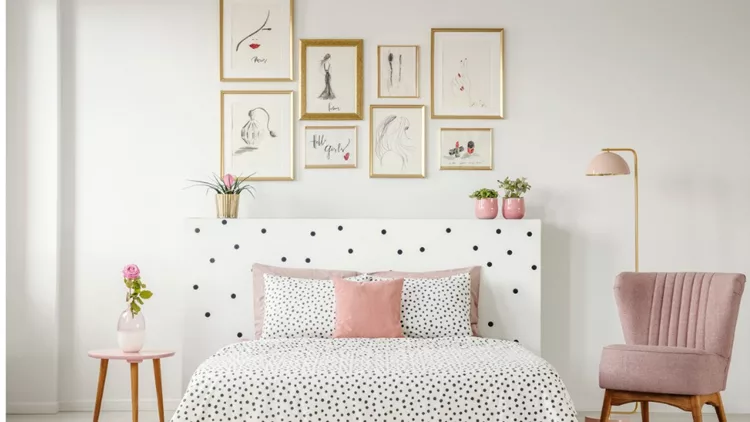 feminine-bedroom-interior-with-a-double-bed-with-dotted-sheets-art-picture-id991205262