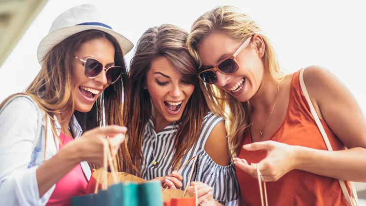 Three women shopping together.