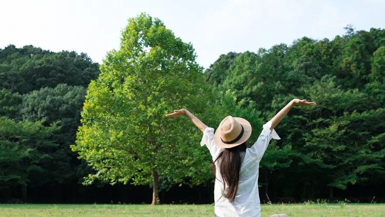 Woman relaxing in a lawn