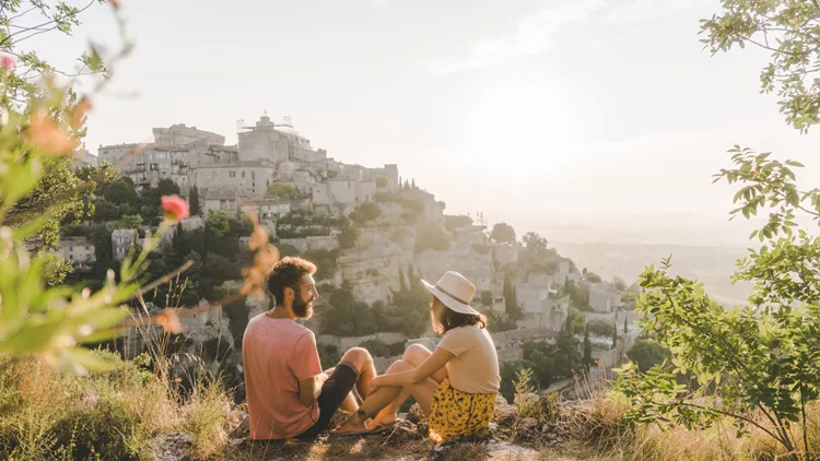 Woman and man looking at scenic view  of Gordes village in Provence