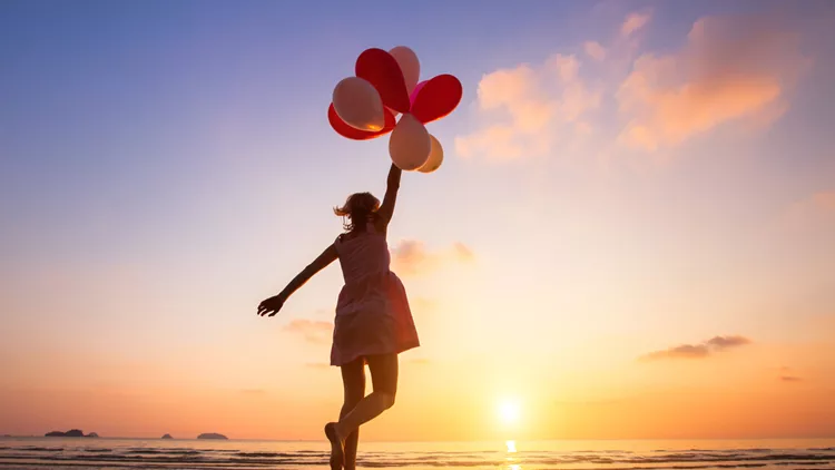 imagination, happy girl flying on multicolored balloons, dreamer