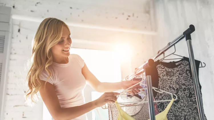 Young woman choosing clothes