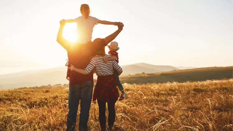 happy-family-mother-father-children-son-and-daughter-on-sunset-picture-id996496112(1)