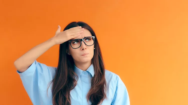 Forgetful Brainy Girl Trying to Remember Her Clever Idea