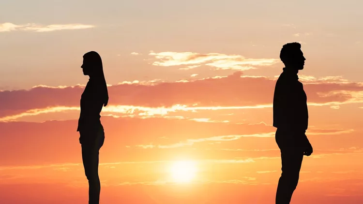 Couple Silhouette Standing Away From Each Other
