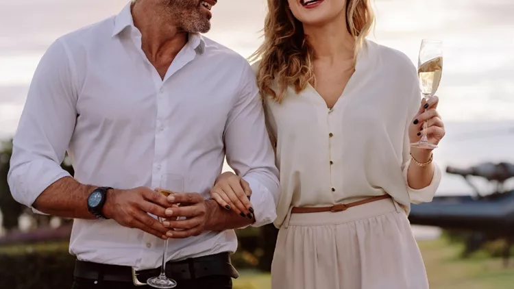 smiling-couple-walking-outdoors-picture-id961730902