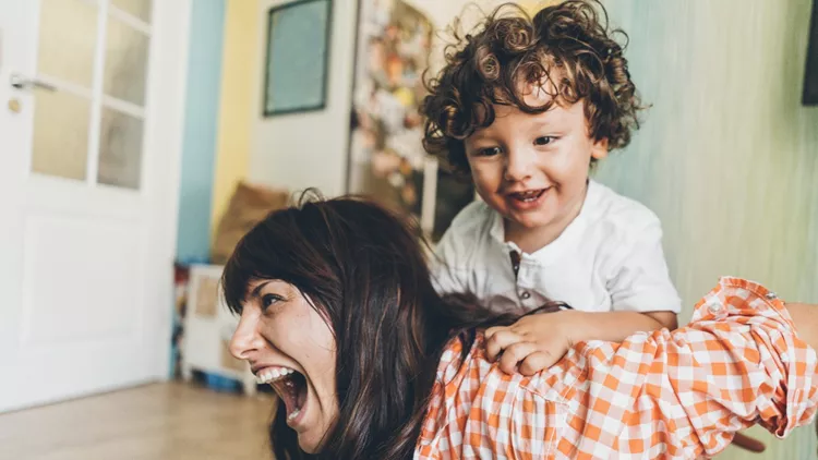 Mother and son having fun at home