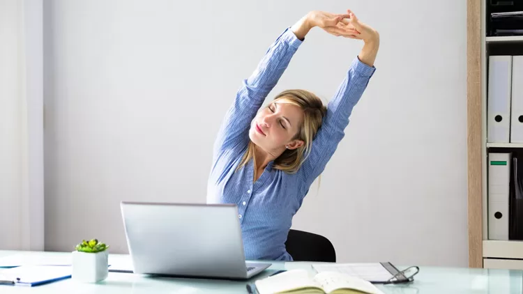 Businesswoman Stretching Her Arms