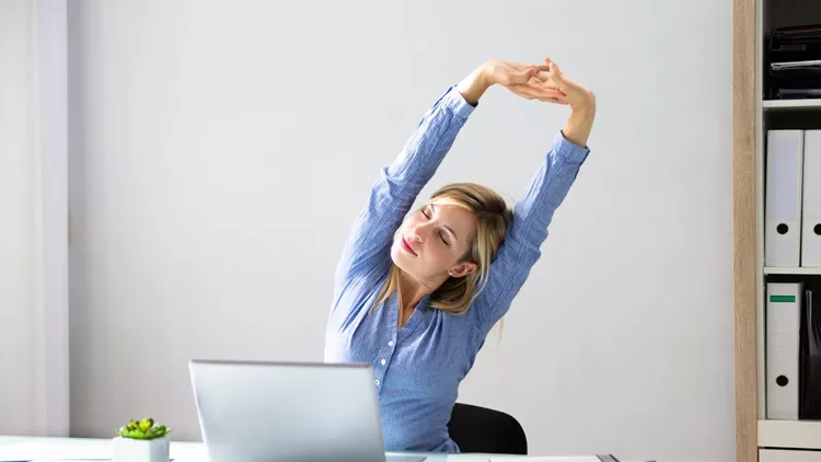 Businesswoman Stretching Her Arms