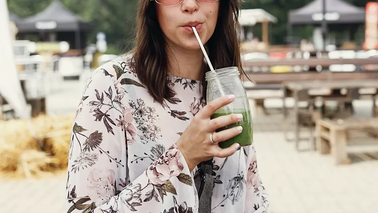 zero-waste-at-street-food-festival-stylish-hipster-boho-girl-drinking-picture-id1135186228