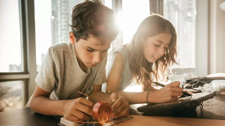 Pre-teens building new robotic system