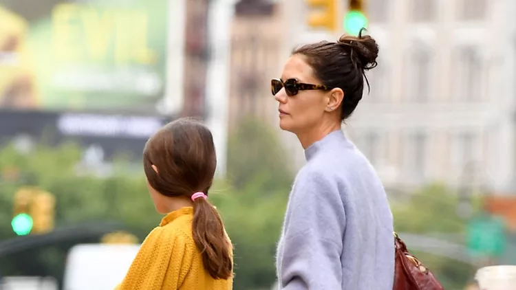 Katie Holmes And Daughter Suri Wear Their Sweaters In New York City