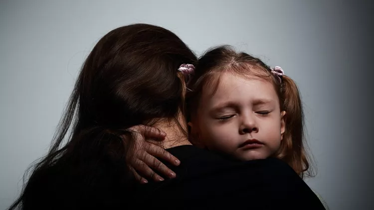 Sad crying daughter hugging her mother