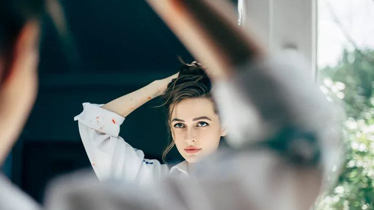 https://www.istockphoto.com/photo/beautiful-young-woman-looking-herself-reflection-in-mirror-gm1026279730-275231183