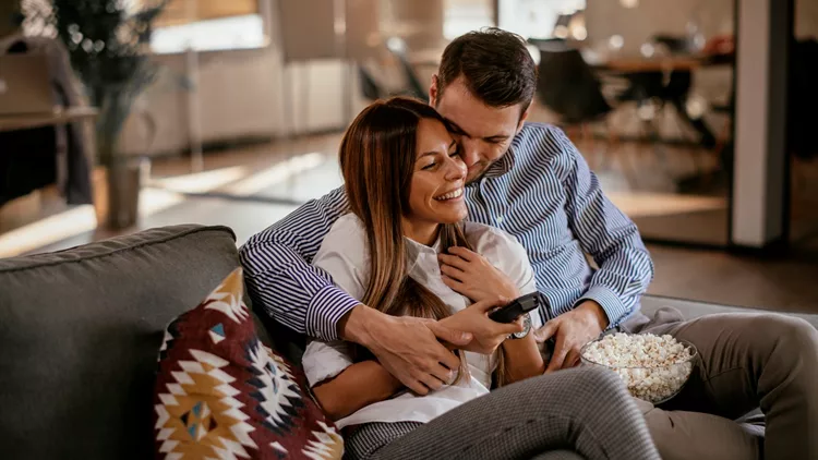 Couple at home watching TV