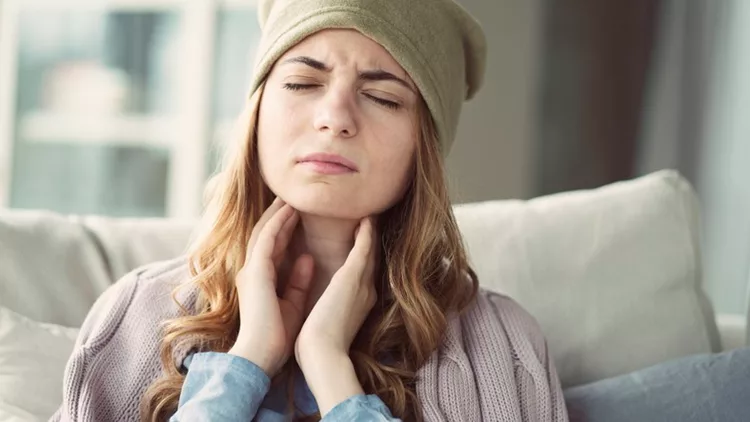 Young woman suffering from cold