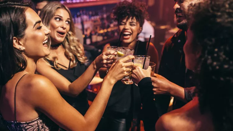 Group of friends partying in a nightclub