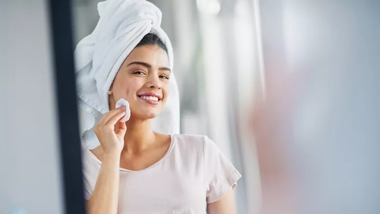 Cleansing her skin to reveal her natural beauty