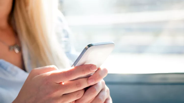 Women using her Smartphone and texting