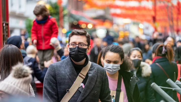 People wearing a face masks to protecting themself because of epidemic in China. Selective Focus. Concept of coronavirus quarantine.