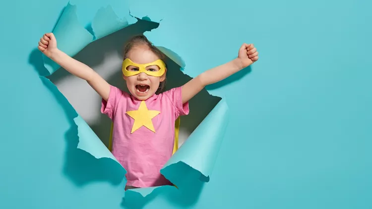 child playing superhero