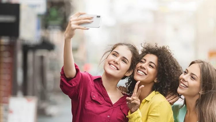 Diverse happy women walking in the city