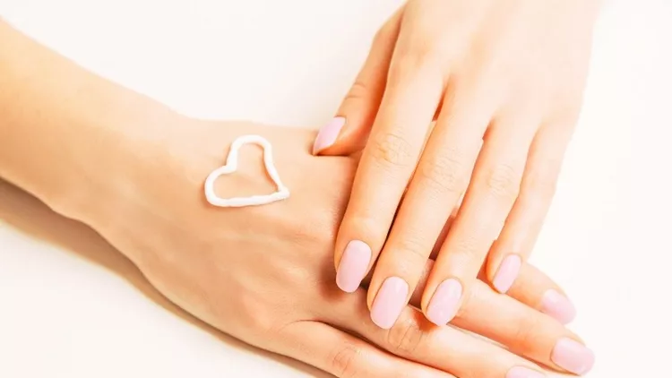 Moisturizing cream on a female hand.