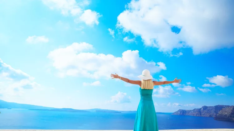 Beautiful Woman in  Oia, Santorini, Greece.