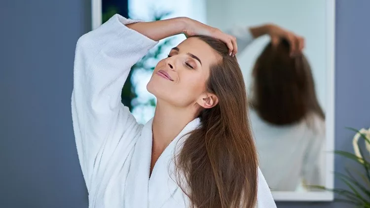 Beautiful brunette woman in the bathroom