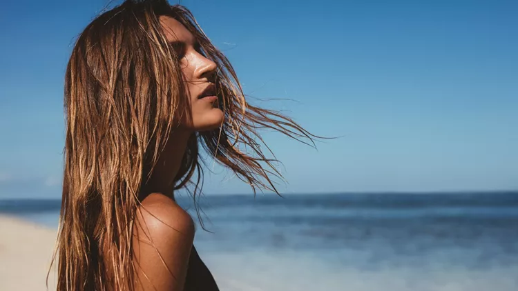 Beautiful young woman on the beach