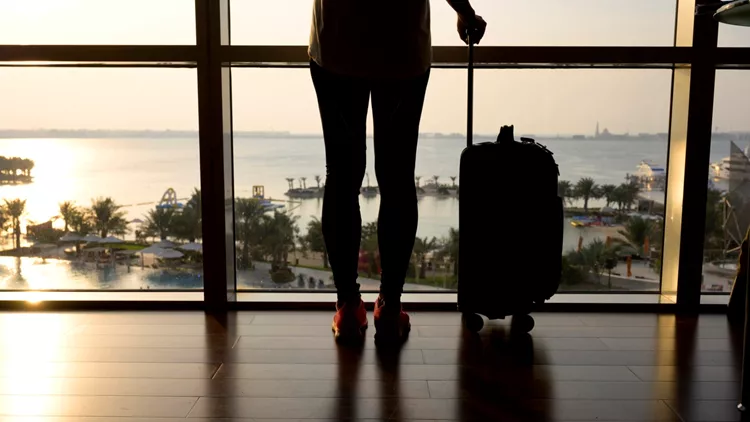 Traveller silhouette with bag