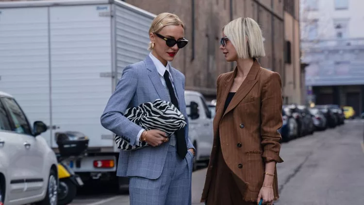 Milan, Italy - 20 February 2020: Stylish persons are posing for photographers before Max Mara fashion show on Milan Woman's Fashion Week F/W2020-2021, street style