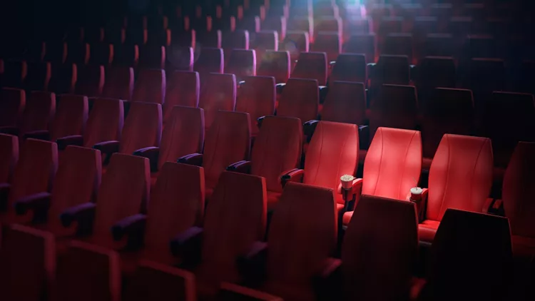 empty cinema chairs, popcorn and cola