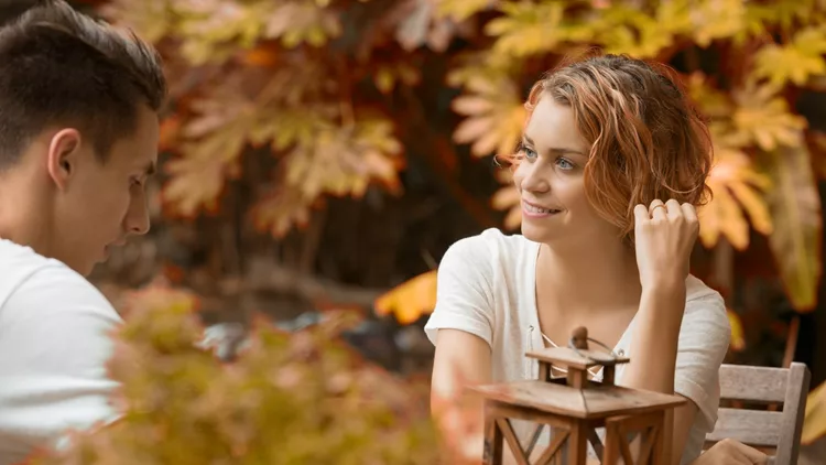 young happy beautiful couple speaking automn time