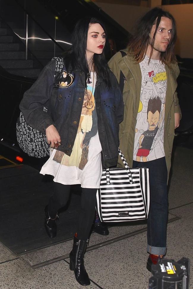 UK CLIENTS MUST CREDIT: AKM-GSI ONLY Frances Bean Cobain and her fiancé Isaiah Silva make their way through LAX after their return home from the Sundance Film Festival. The 22-year-old daughter of Kurt Cobain reunited with her mom Courtney Love, for the first time in five years, at the premiere of 'Kurt Cobain: Montage of Heck'. Pictured: Frances Bean Cobain, Isaiah Silva Ref: SPL936907 260115 Picture by: AKM-GSI / Splash News 