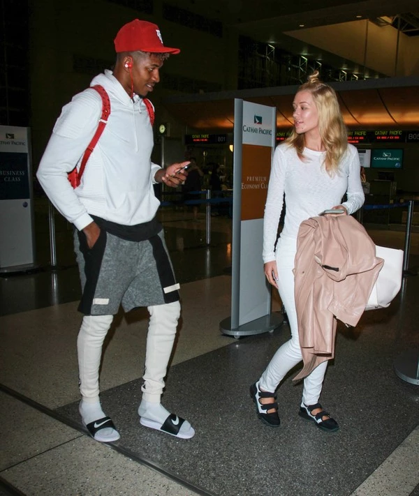 Iggy Azalea and Nick Young seen at LAX airport in Los Angeles, California. Pictured: Iggy Azalea and Nick Young Ref: SPL1104124 160815 Picture by: Diabolik / Splash News Splash News and Pictures Los Angeles:310-821-2666 New York: 212-619-2666 London: 870-934-2666 photodesk@splashnews.com 