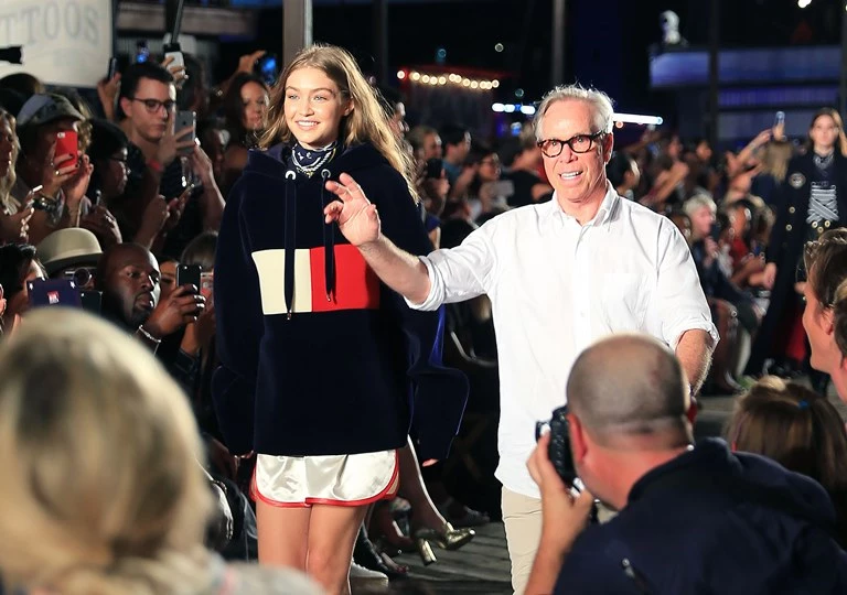 Taylor Swift cheers Gigi Hadid as she walks the Tommy Hilfiger show with Tommy Hilfiger, with Martha Hunt, Lewis Hamilton, Anwar Hadid, and mom Yolanda Hadid at South Street Seaport in New York Pictured: Taylor Swift Martha Hunt, Lewis Hamilton, Anwar Hadid, Yolanda Hadid Ref: SPL1350184 090916 Picture by: Jackson Lee / Splash News Splash News and Pictures Los Angeles: 310-821-2666 New York: 212-619-2666 London: 870-934-2666 photodesk@splashnews.com 